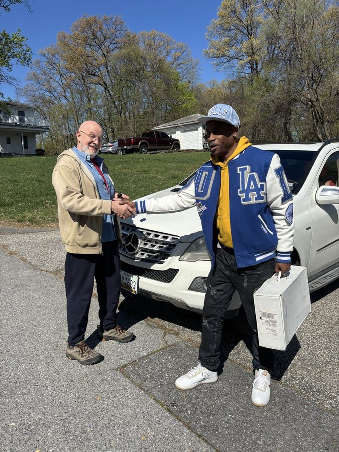 Chad Taylor shaking hands with a satisfied client after completing a home inspection