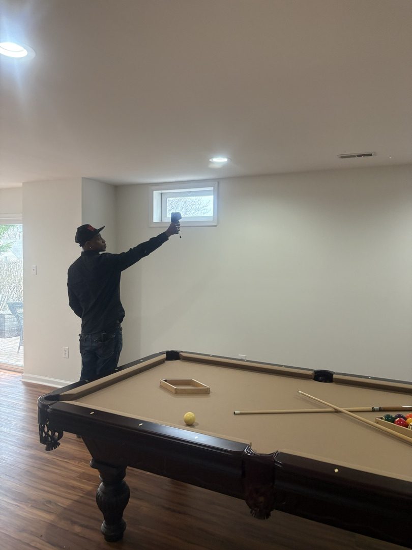 Chad using moisture detection equipment during a home inspection